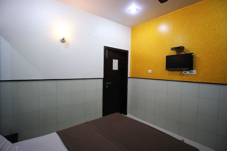 Cama en dormitorio compartido Hotel Sharda Sion