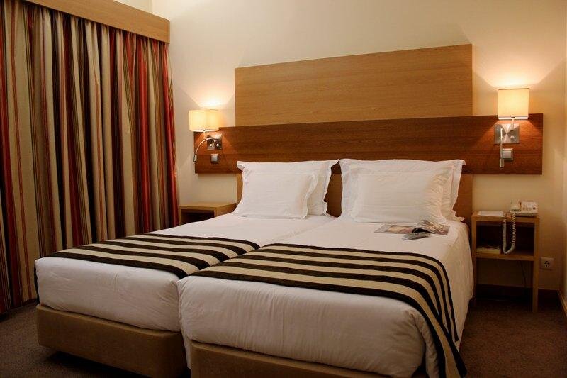 Кровать в общем номере Hotel Principe Lisboa