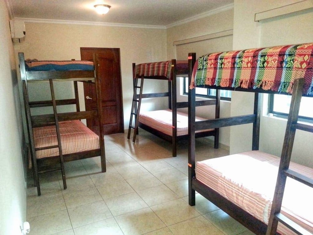 Кровать в общем номере Casa MonaLisa PTY