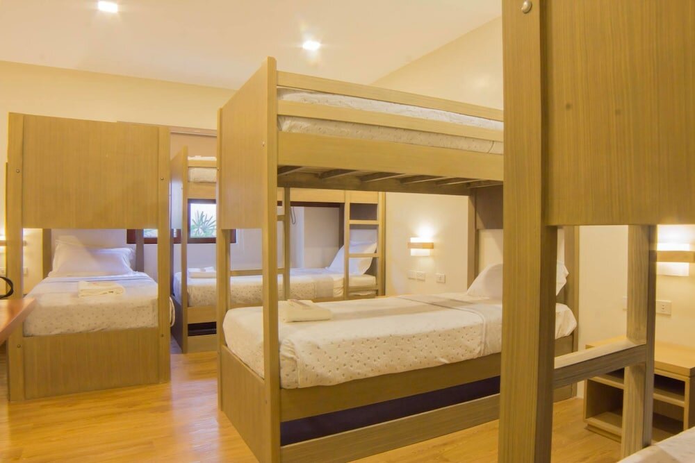 Кровать в общем номере Hotel Rosita