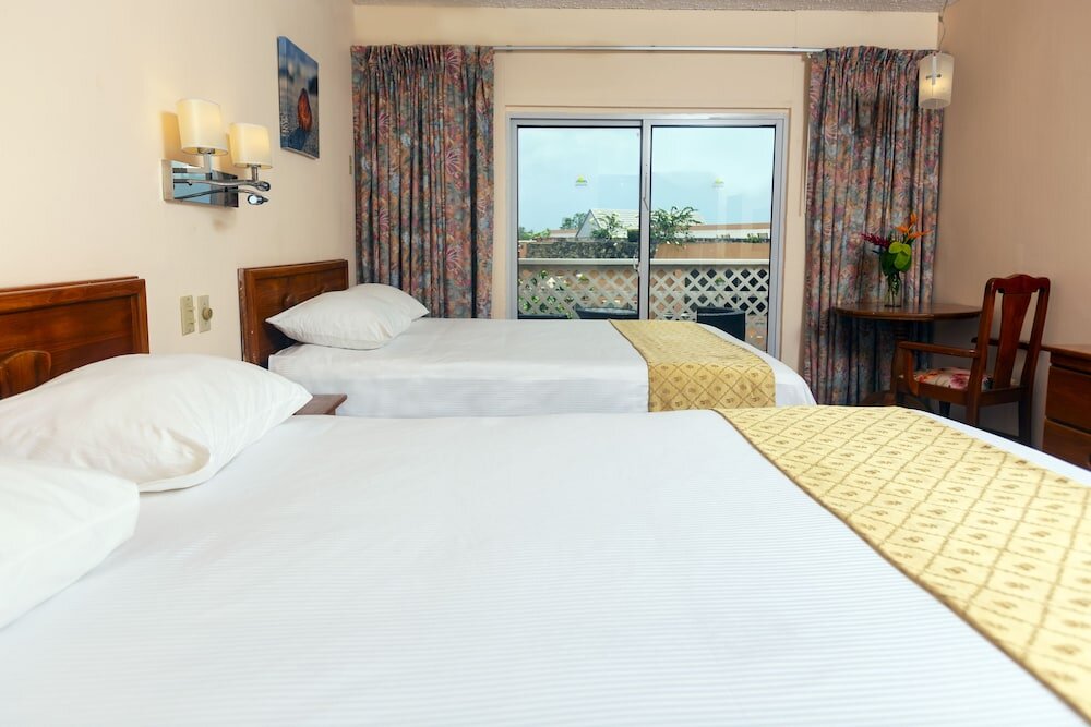 Standard Vierer Zimmer mit Balkon und mit Gartenblick Grafton Beach Resort