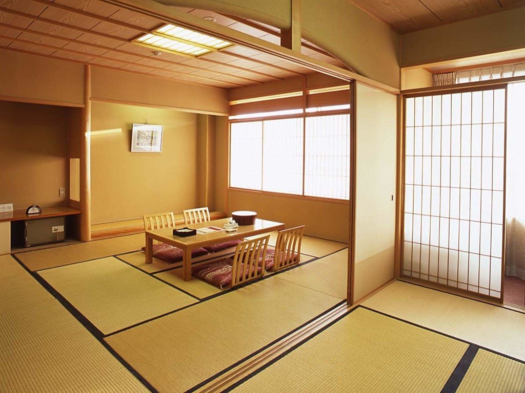 Кровать в общем номере Hotel Sakushu Musashi