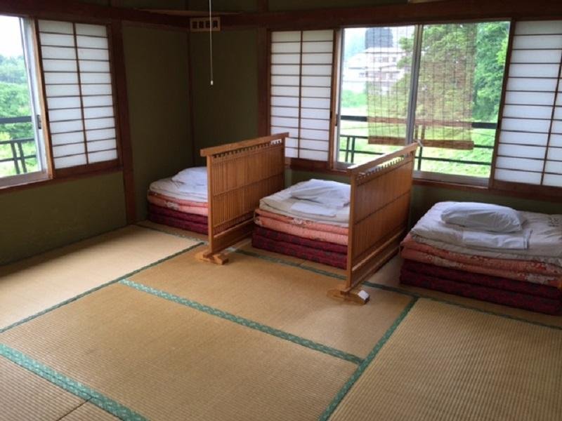 Cama en dormitorio compartido Minshuku Fugakuso