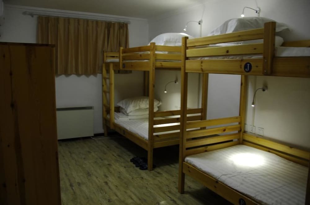 Кровать в общем номере Beijing Lucky Family Hostel