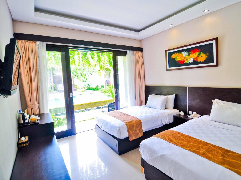 Deluxe chambre avec balcon et Vue piscine ABISHA Hotel Sanur