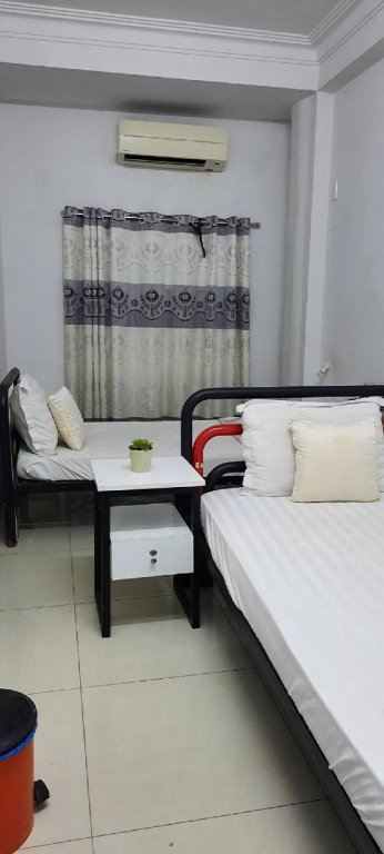 Кровать в общем номере Khoi Hostel