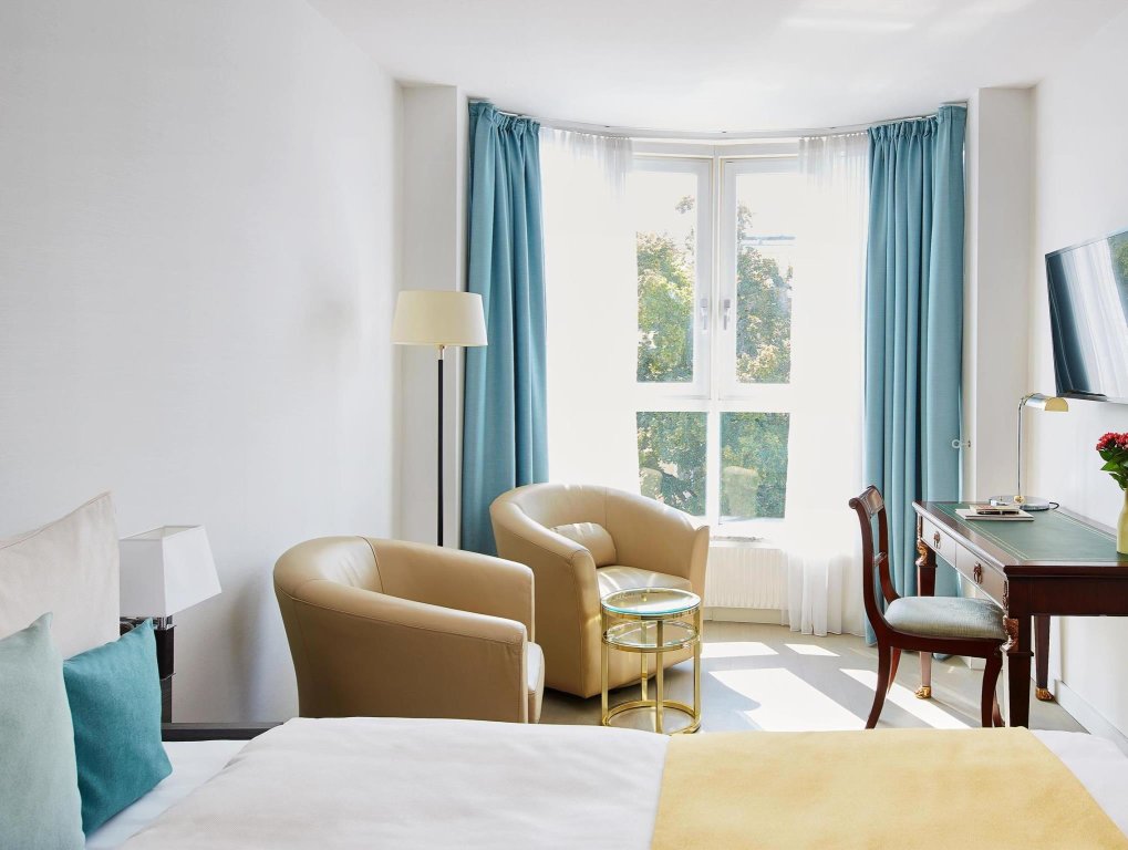Кровать в общем номере Living Hotel Kaiser Franz Joseph