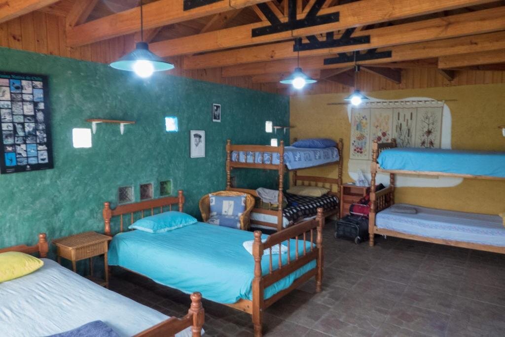Cama en dormitorio compartido Casa Chueca - DiVino