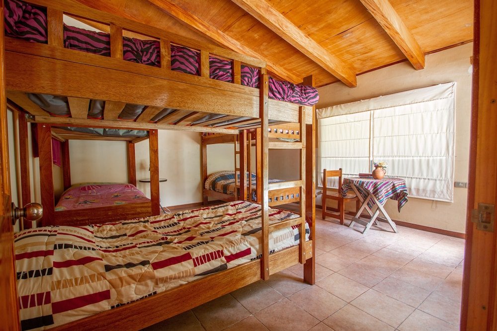 Cama en dormitorio compartido Yakumama Hostel y Restaurant