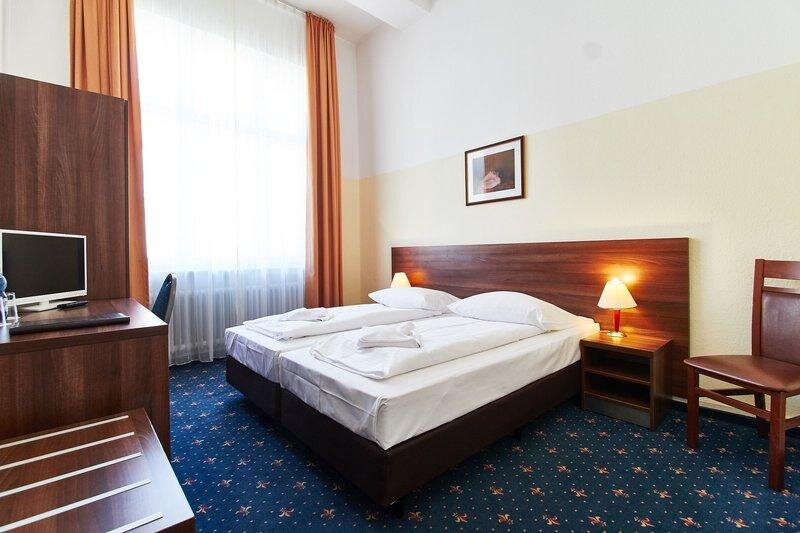 Кровать в общем номере Hotel Europa City