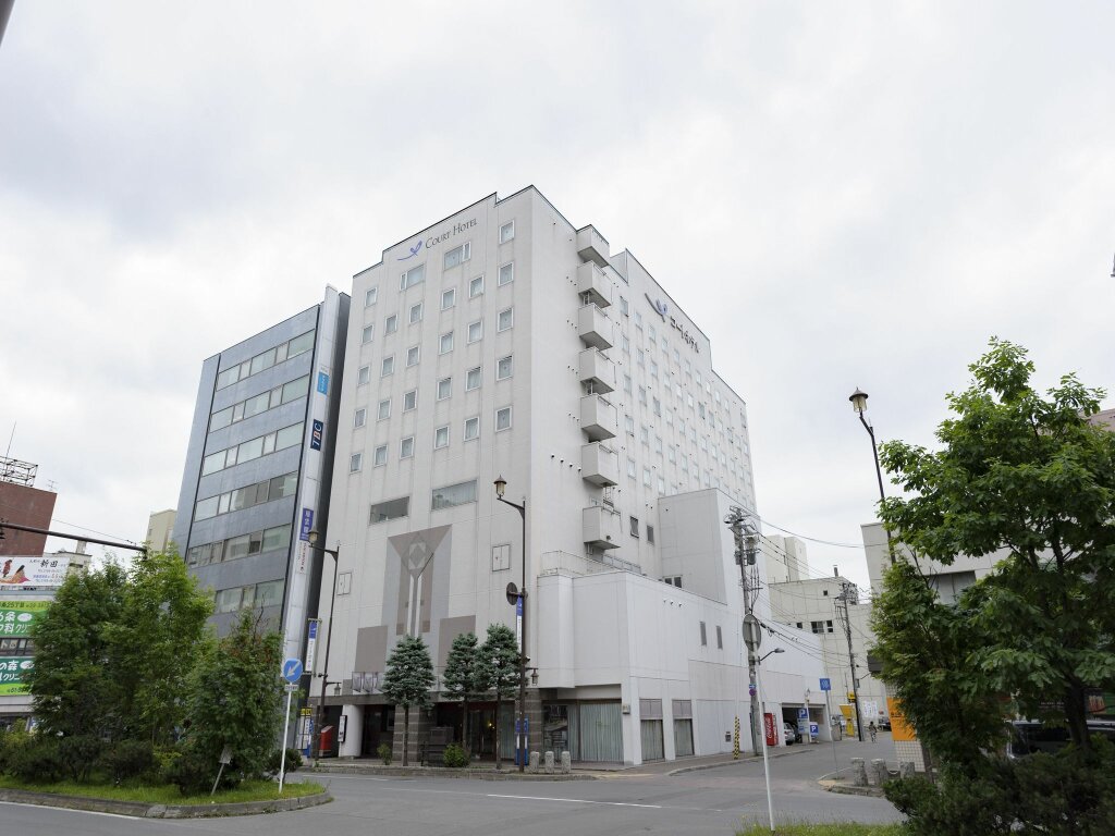 Кровать в общем номере Court Hotel Asahikawa