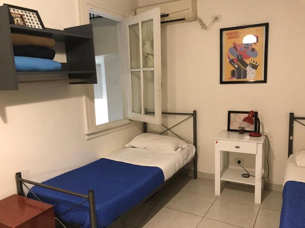 Кровать в общем номере Reina Madre Hostel