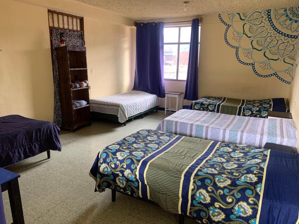 Кровать в общем номере Kasa Kiwi Hostel & Travel Agency