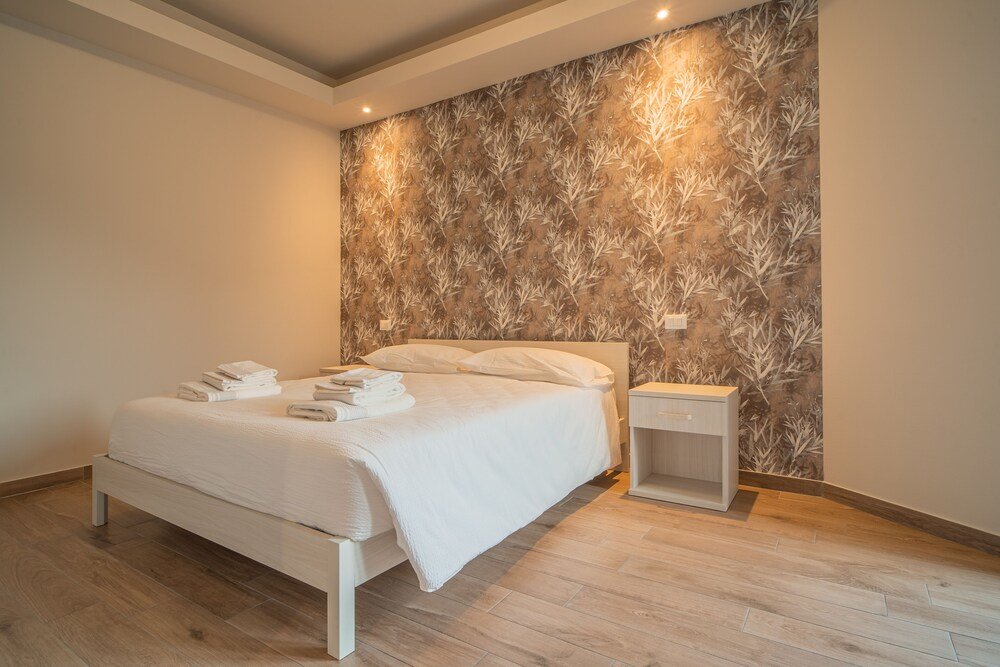 Deluxe Zimmer Le Alpi bed&living