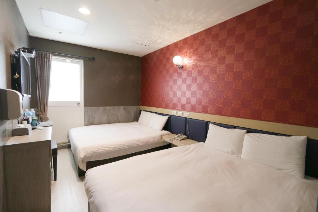 Standard quadruple chambre avec balcon Chao She Hotel