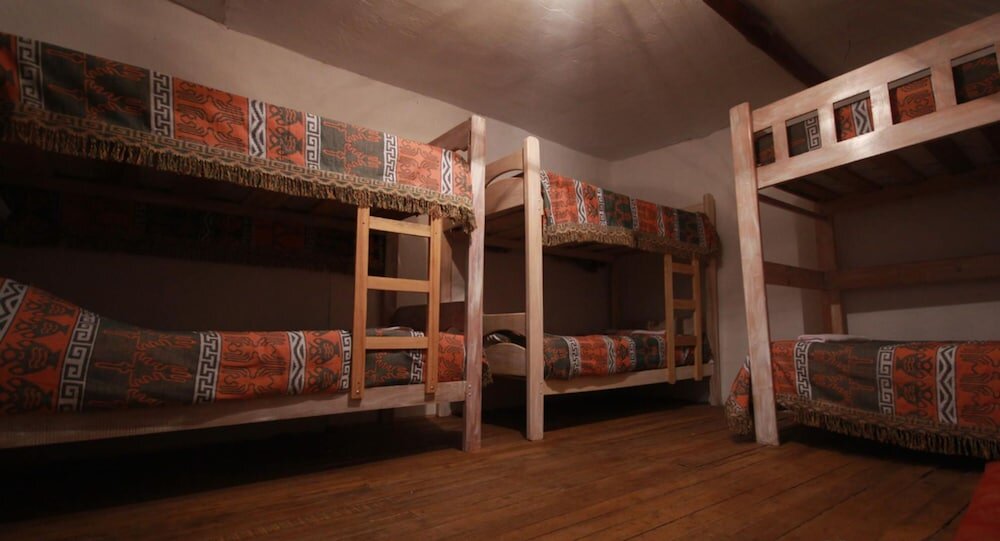 Bett im Wohnheim Qosqomanta Hostel
