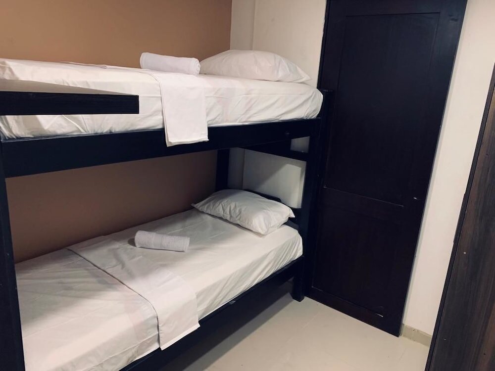 Кровать в общем номере Otro Mundo Hostel