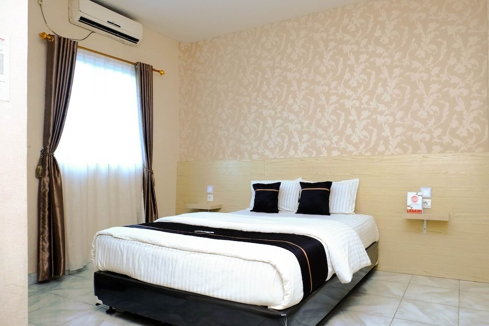 Номер Deluxe OYO 2455 Hotel Surya Bengkalis Syariah
