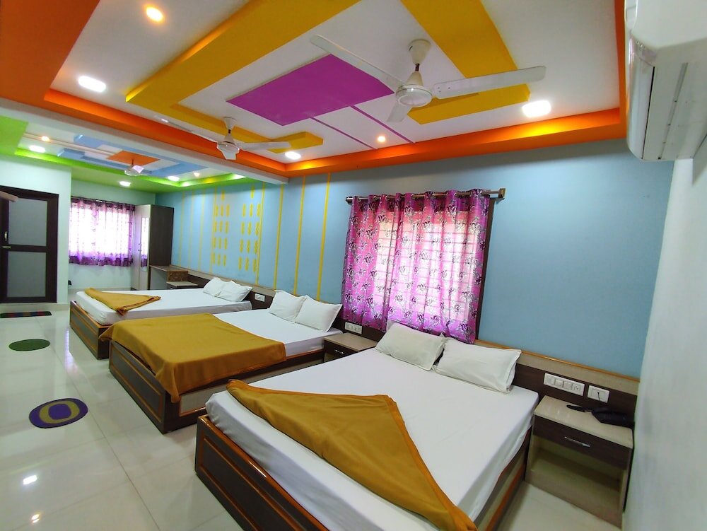 Cama en dormitorio compartido Srii Devi Residency