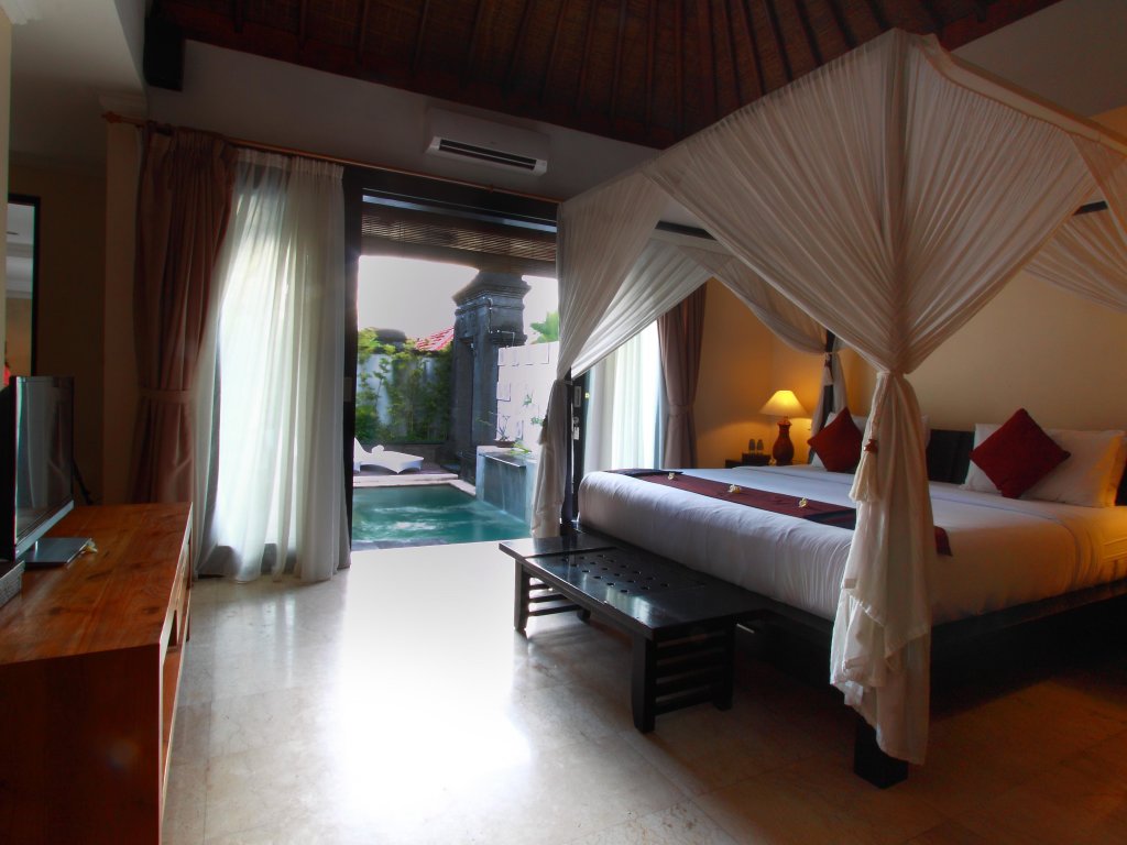 Кровать в общем номере Bali Nyuh Gading Villas
