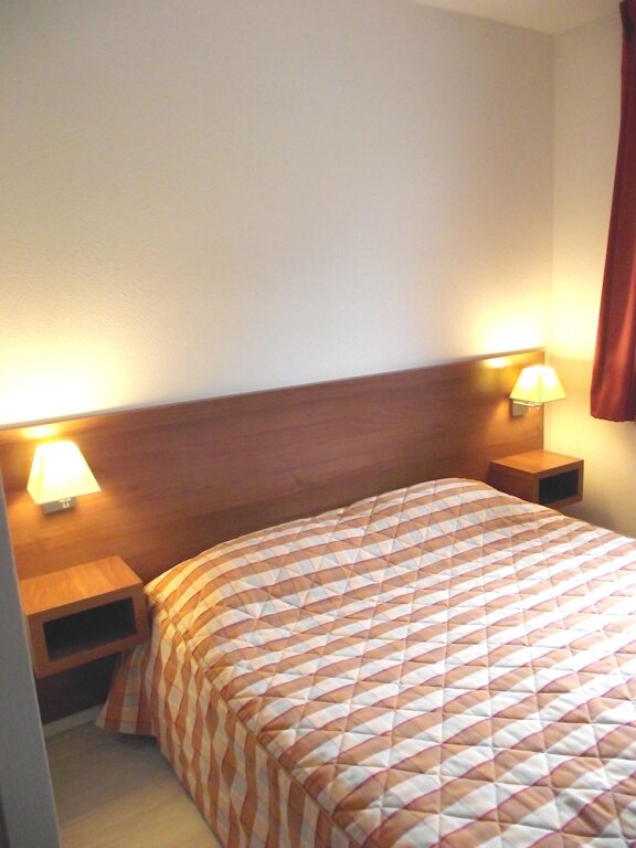 Кровать в общем номере Résidence Tourmalet
