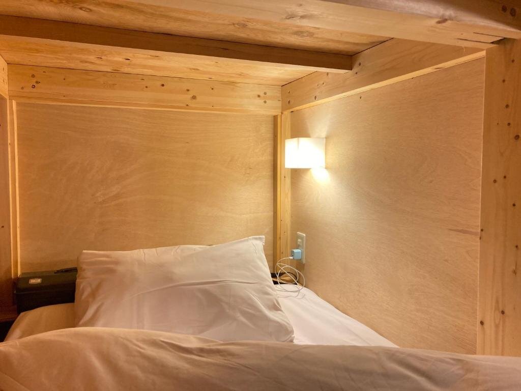 Кровать в общем номере Guest House Preta Torami