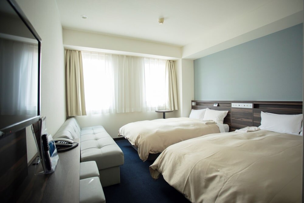 Кровать в общем номере (мужской номер) Hiroshima Pacific Hotel