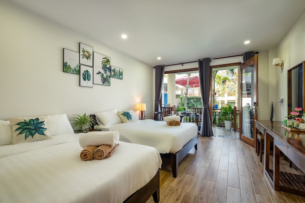 Standard quadruple famille chambre avec balcon et Vue piscine Melica Resort & Spa Phu Quoc