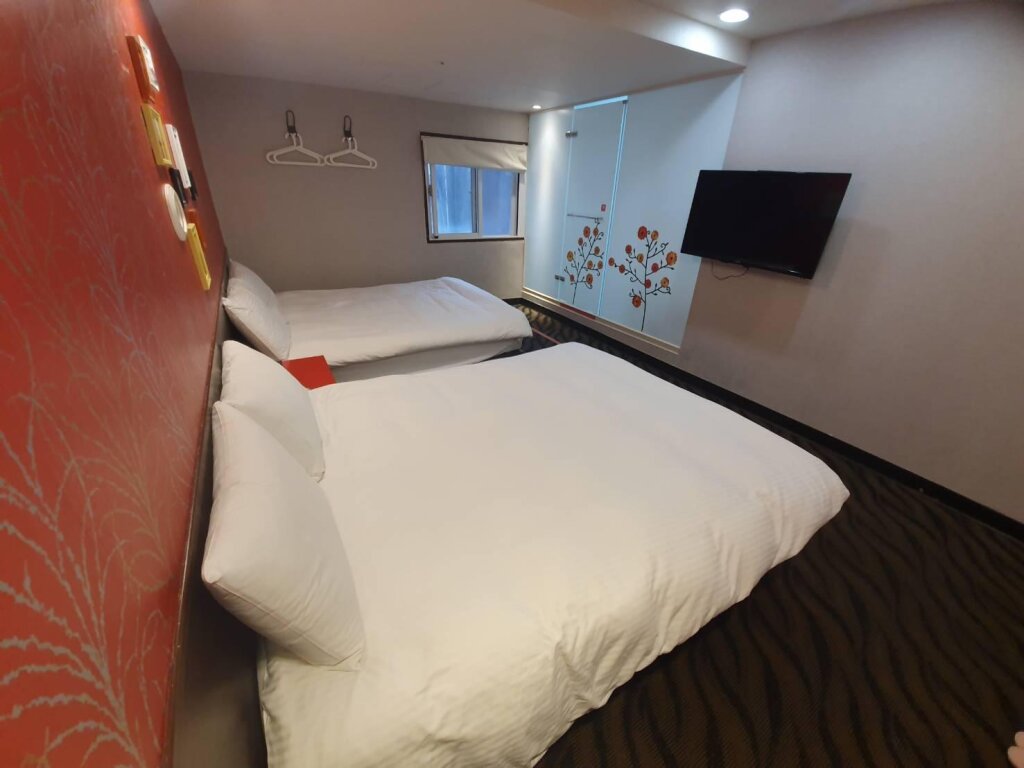 Standard quadruple chambre Funny Ximen Hotel