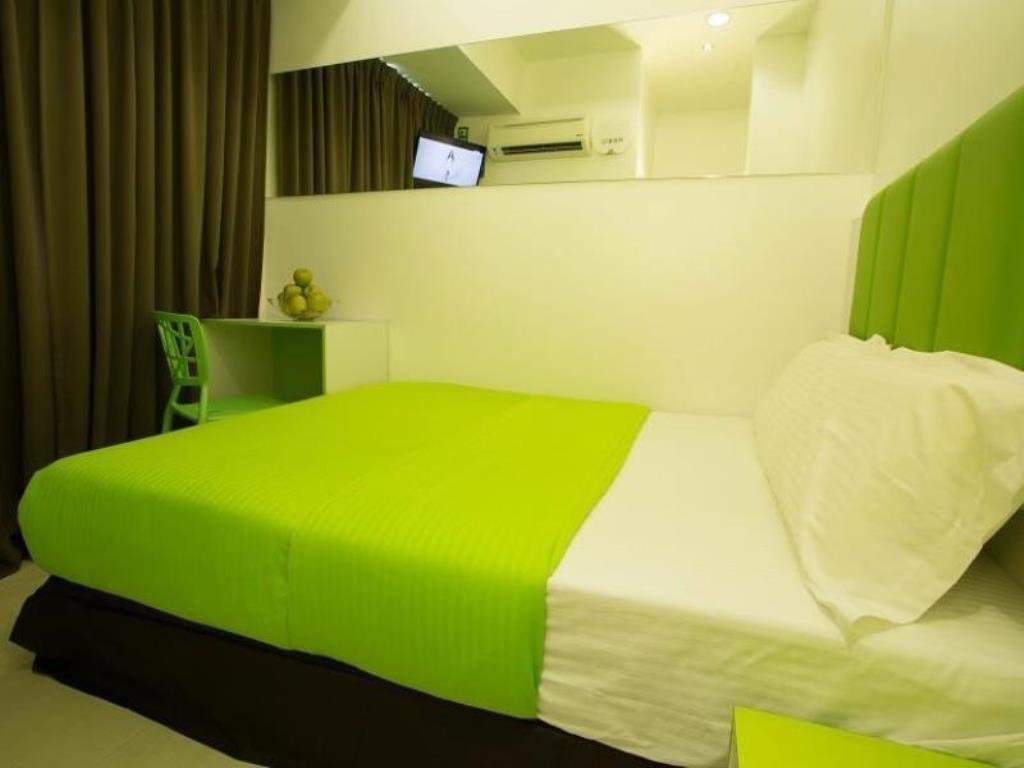 Cama en dormitorio compartido Apple Hotel