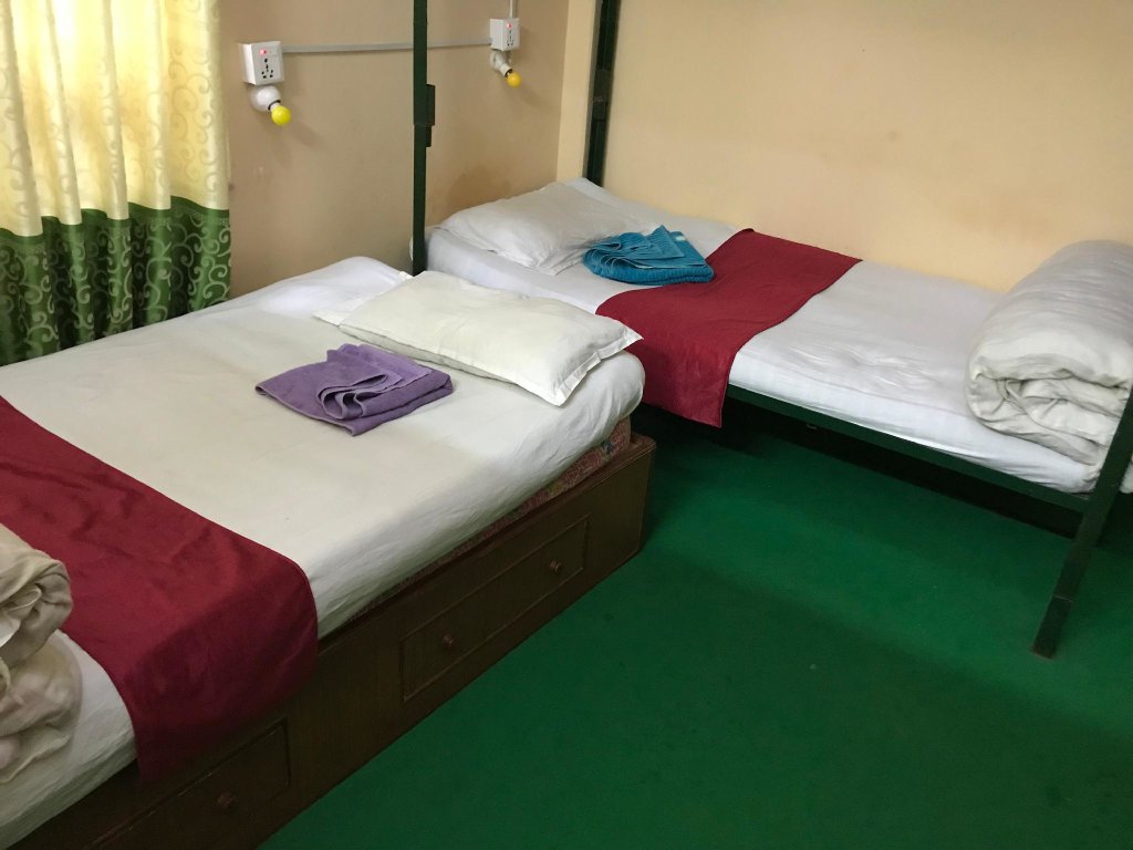 Кровать в общем номере Aroma Tourist Hostel
