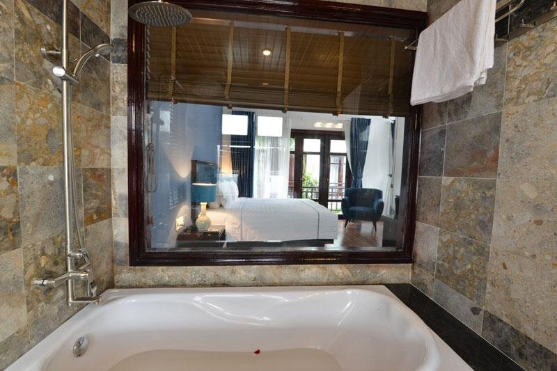 Deluxe room with balcony and with garden view TTC Hotel - Hoi An
