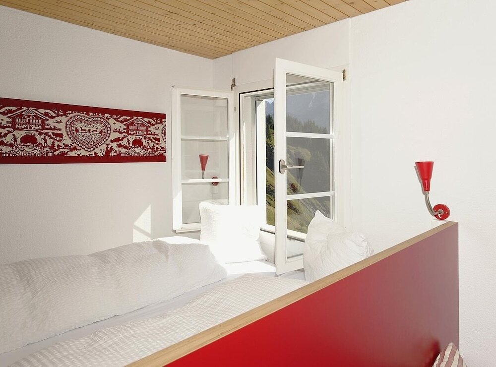Кровать в общем номере с видом на горы Alpinhotel Bort