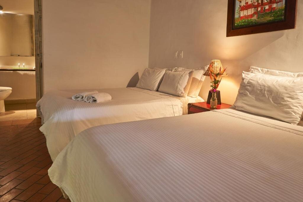 Deluxe Quadruple room Hotel Hacienda Combia