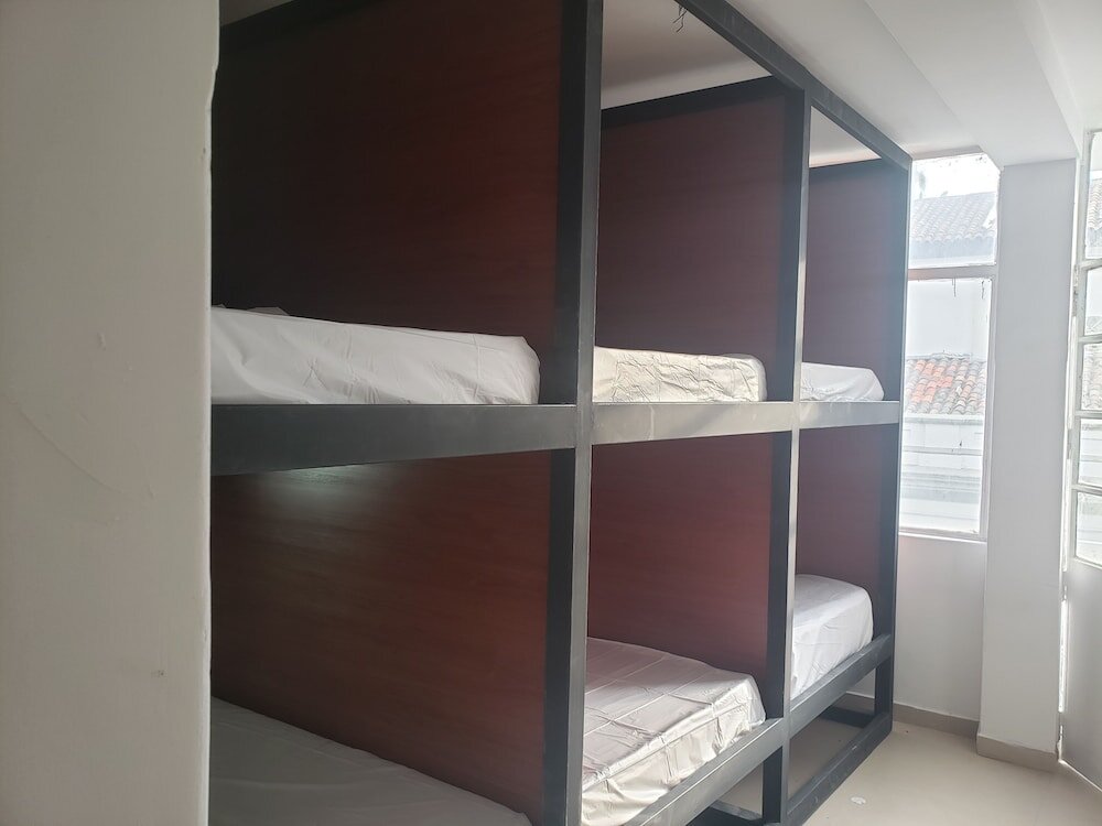 Кровать в общем номере Aima Ibagué