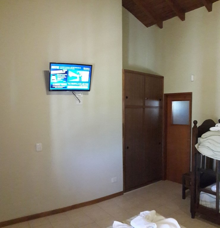 Standard Triple room with balcony Posada del Infinito