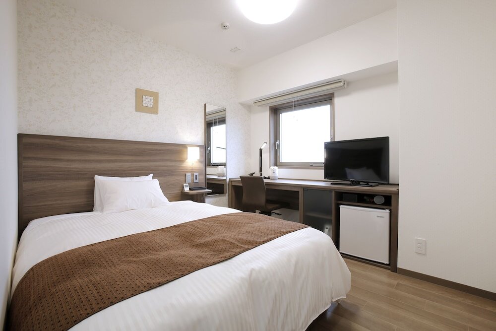 Кровать в общем номере (женский номер) Hotel Sunoak Kashiwanoha