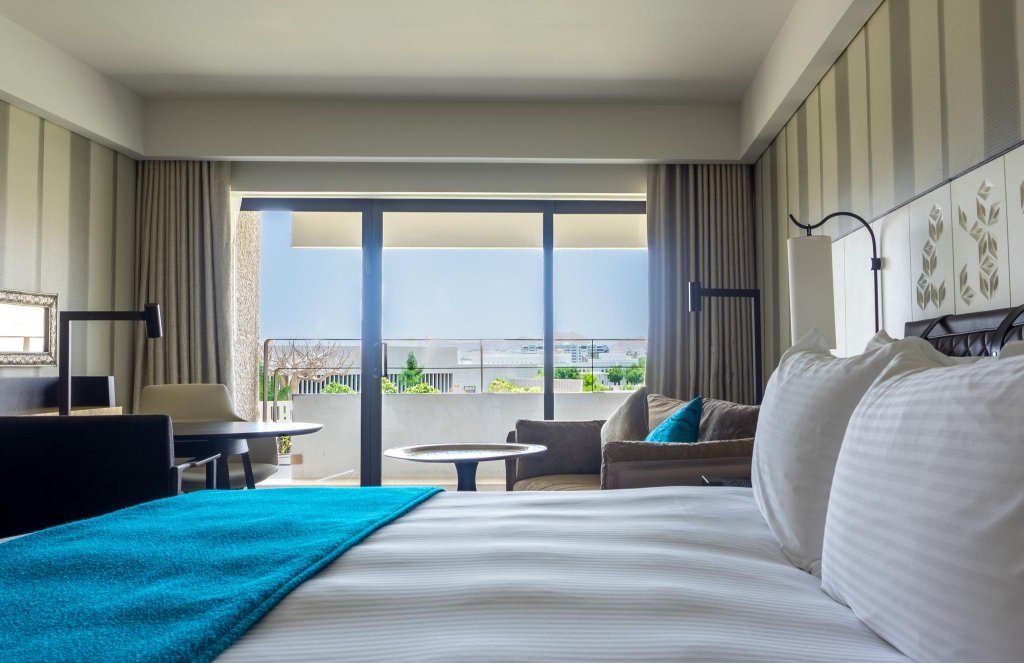 Standard Quadruple room with balcony and with city view InterContinental Muscat, an IHG Hotel