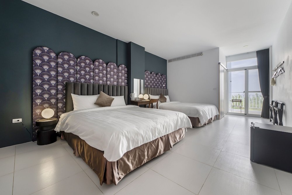 Standard quadruple chambre avec balcon et Vue mer H& Sunset Mu Style Inn
