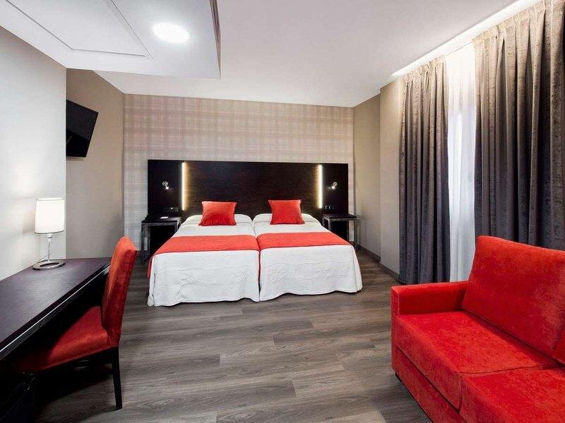 Кровать в общем номере Hotel Zentral Parque