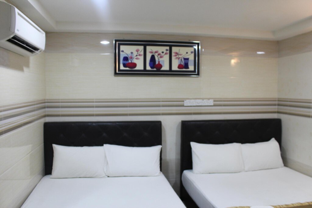 Habitación cuádruple Estándar New Wave Hotel Melawati