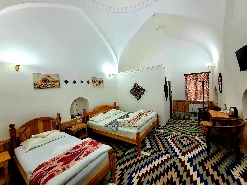 Deluxe chambre madrasah Polvon-Qori boutique hotel