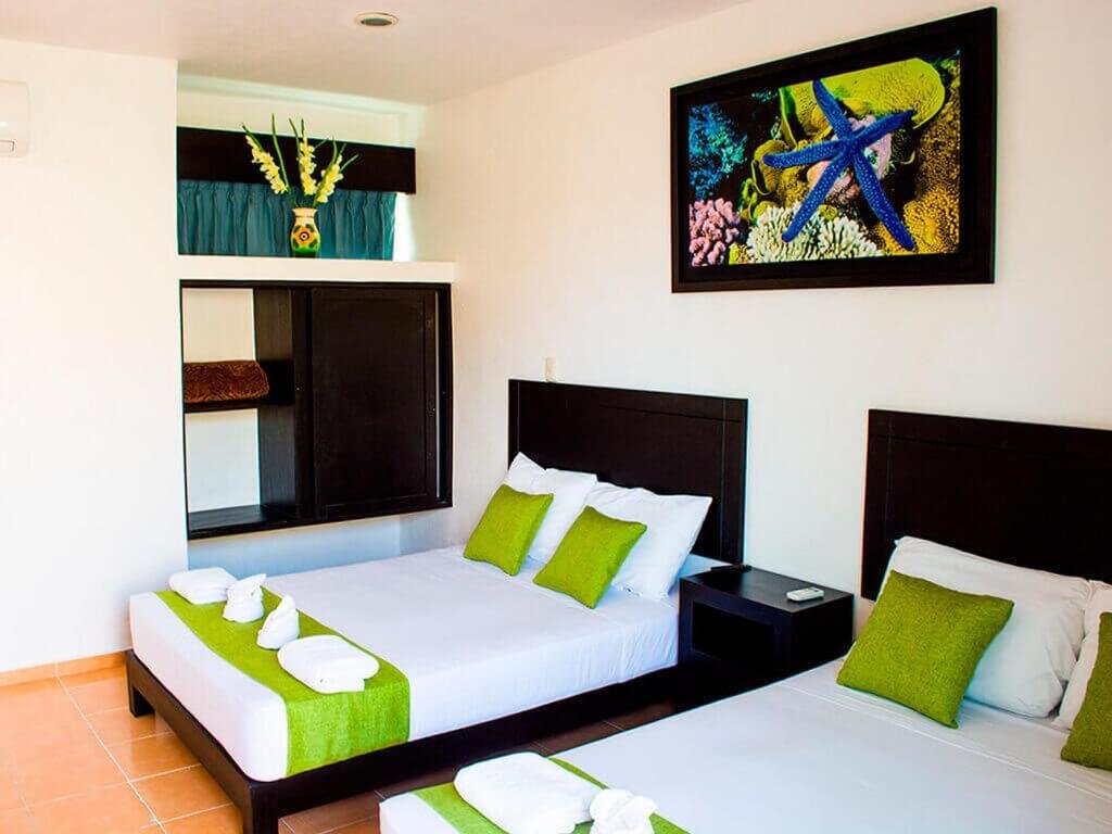 Standard quadruple chambre Hotel Arrecifes Costamaya