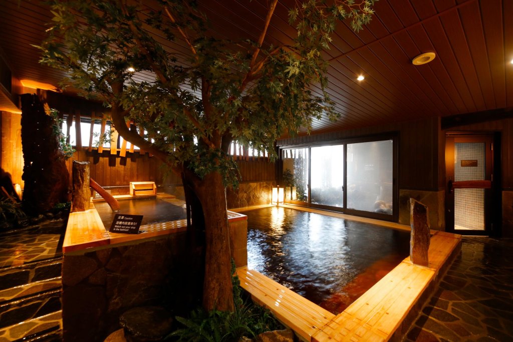Кровать в общем номере Dormy Inn Toyama Natural Hot Spring
