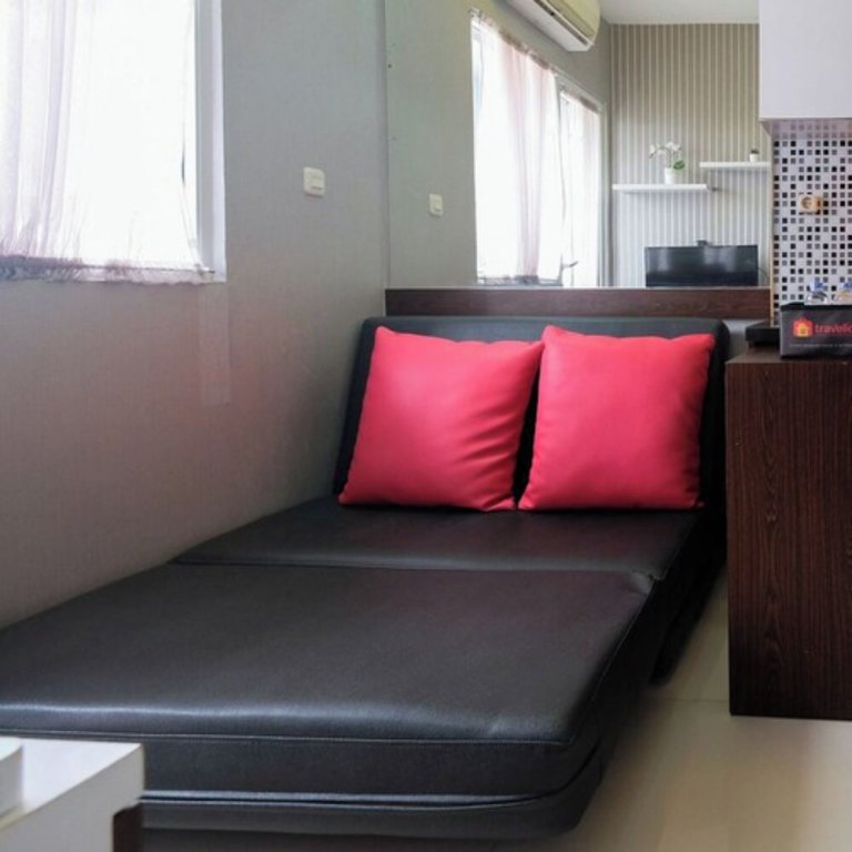 Апартаменты Homey and Relaxing 2BR Green Pramuka Apartment