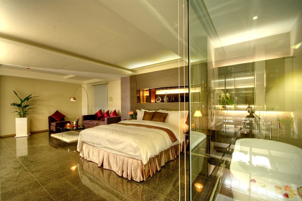 Кровать в общем номере Kapok Hotel & Resorts
