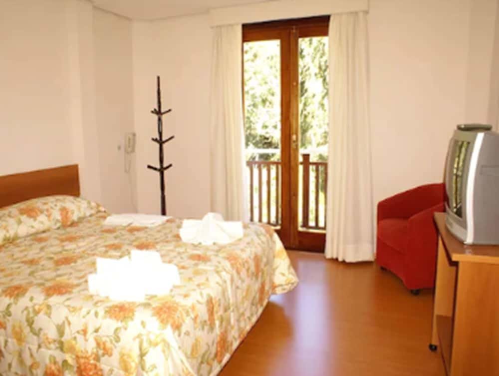 Standard Quadruple room with balcony Pousada Joia da Serra by Hotel Platanus