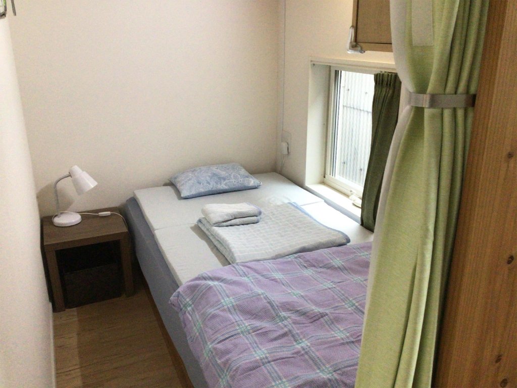 Кровать в общем номере Itosima Guesthouse TOMO