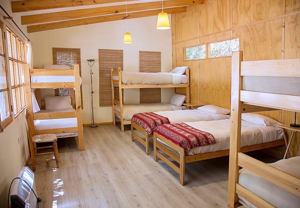 Кровать в общем номере El Arbol Eco Lodge