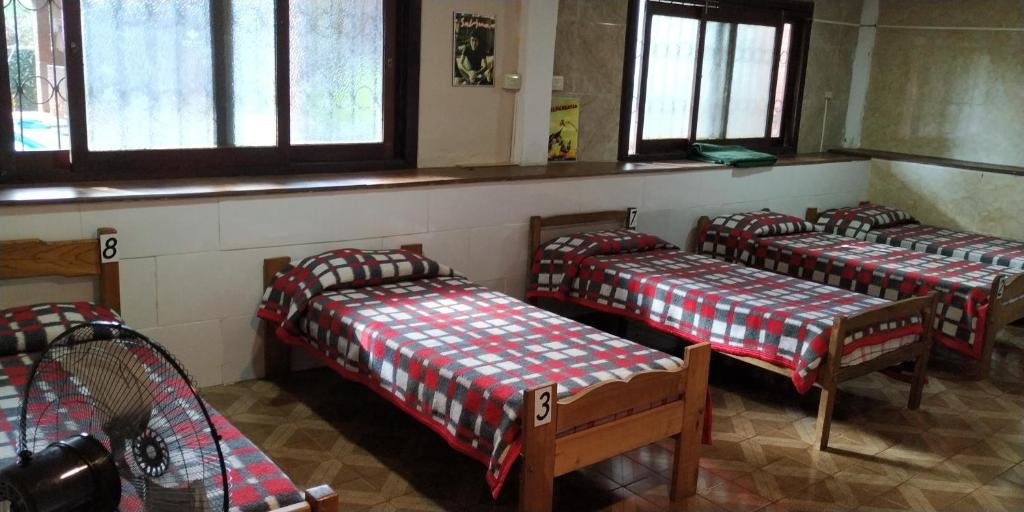 Кровать в общем номере El Guembe Suites